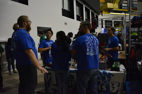 FIRST® Robotics team at their station with robot