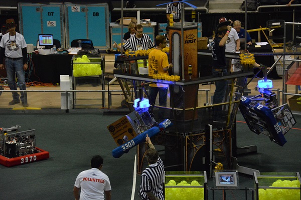 FIRST® Robotics referee gives thumbs-up on playing field