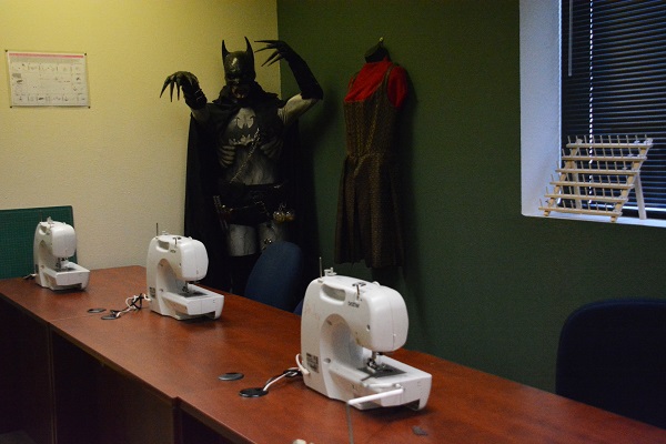 Batman costume near sewing machines