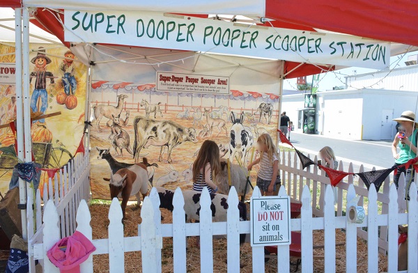 Imaginology attendees work in the "Super Dooper Pooper Scooper" station