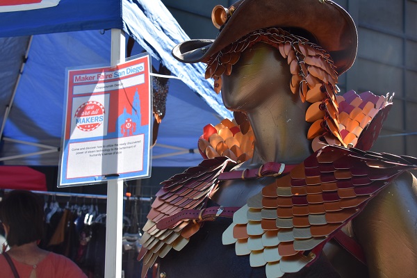 Metal headdress and breastplate displayed on mannequin at Maker Faire® San Diego