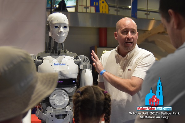 Man displays InMoov robot at Maker Faire ® San Diego 2016.