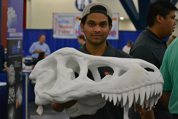 young man with 3D printed dinosaur skeleton head