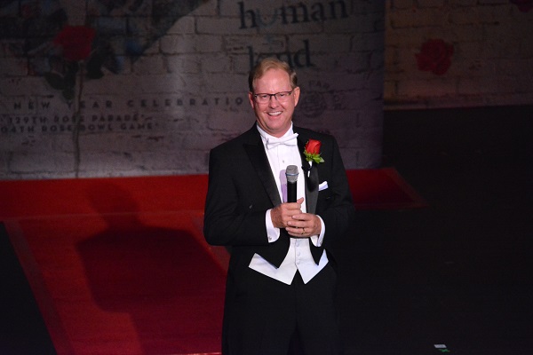 Tournament of Rosess President Lance Tibbet holds mic