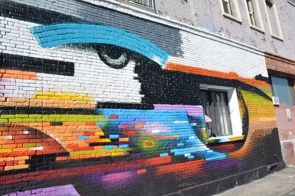 Mural of an eye in a rainbow on the side of a builidng during Maker Walk L.A.