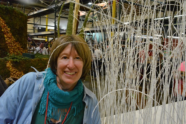 Bonny Kamen with white float materials at Fiesta Parade Floats