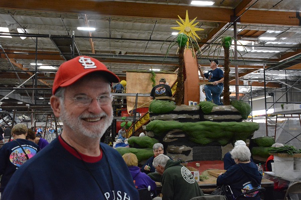 Ed Stelling near Lutheran Hour float in Phoenix Decorating Company's Irwindale float facility