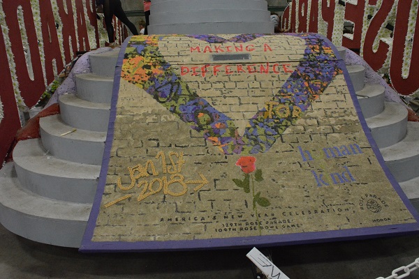 Making a Difference Rose Parade theme banner awaits flowers