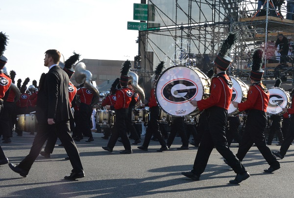 Georgia band in red and black uniforms marches in 129th Rose Parade at Orange Grove and Colorado Boulevards