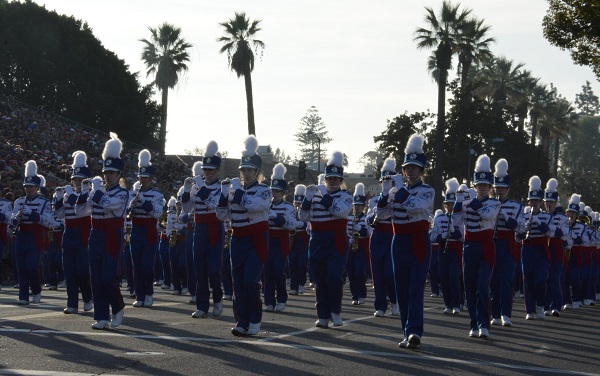 Londonderry band, in red, white and blue uniforms, plays as they march along Orange Grove Boulevard