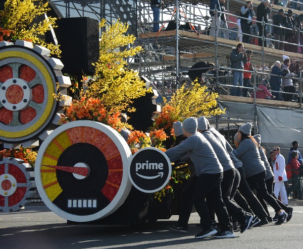 Eight people manually push Amazon Prime float unit