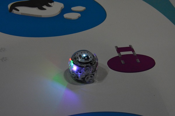 Ozobot 1-inch robot on plastic game sheet