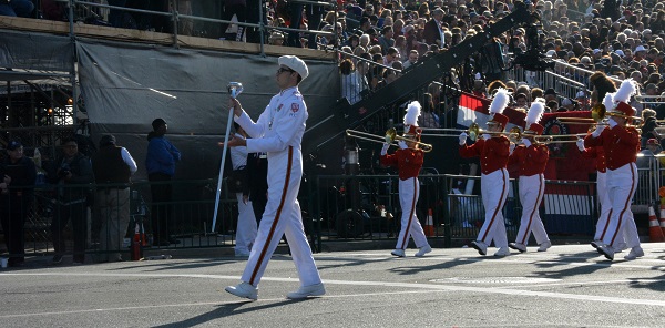 PCC band leader with baton leads Honor Band to Colorado Boulevard