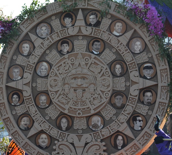 closeup of Aztec sun calendar with portraits of organ donors