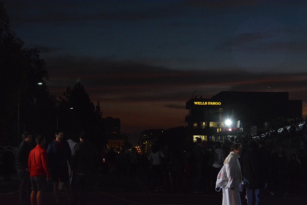 Sunrise over Coloroad Boulevard with white Suiters and parade attendees