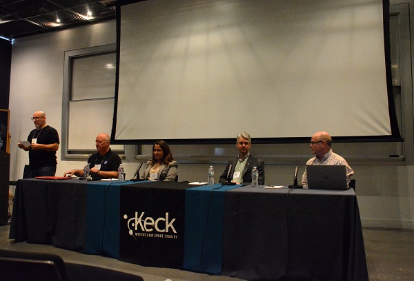 Dr. Scott Davidoff with four-person discussion panel at table with black Keck tablecloth banner