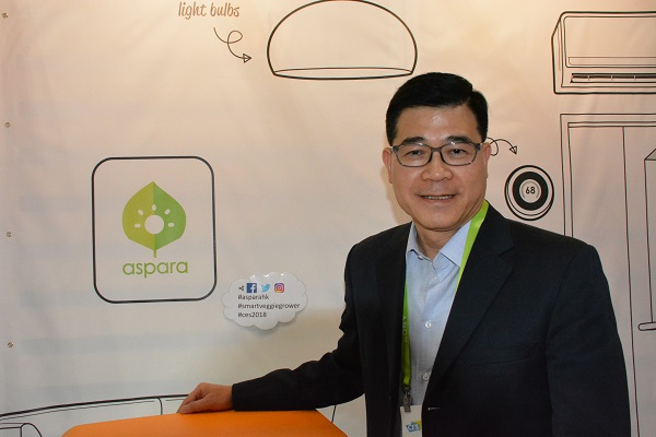 Dr. Leung poses with Aspara hydroponic vegetable grower