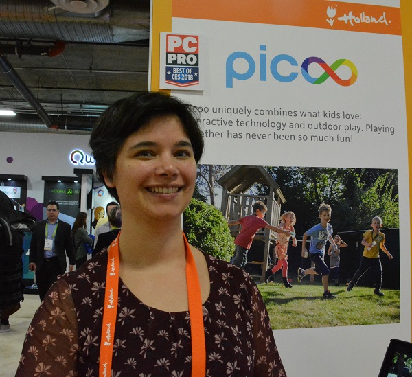 Iris Soute in front of Picoo display with "Holland" and "Best of CES" award logos