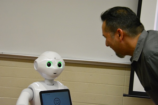 Pepper robot analyzes CSULB's Walter Martinez's facial expression