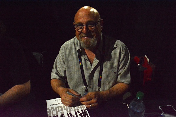 Futurist Charlie Fink signs his book Metaverse at VRLA 2018 conference