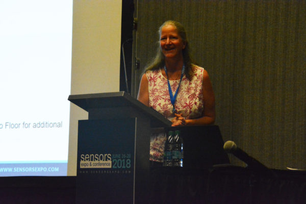 Mary Ann Maher smiles from Sensors podium