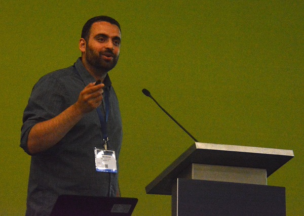 Mohammad Musa in closeup at lectern