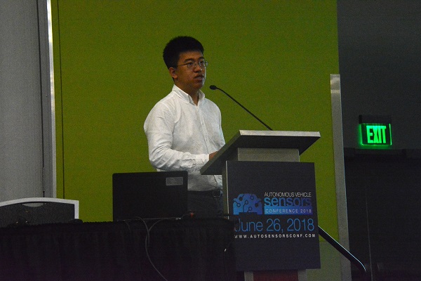 Yi Shan of DEEPHi at podium during Autonomous Vehicle Sensors Conference