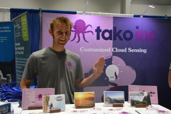 Staffer at Tako Customized Cloud sensing booth