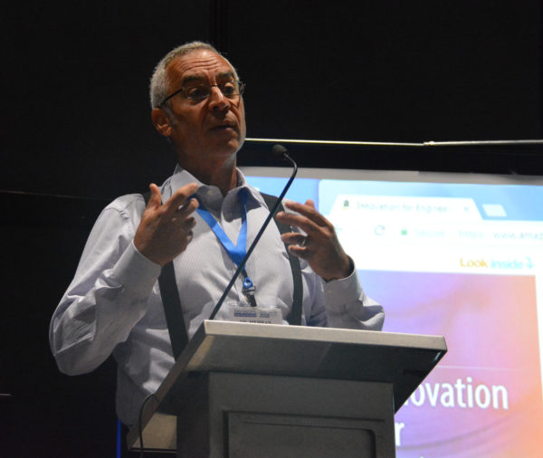 Dr. Mehren Mehregany speaks at lectern during "Future of Engineering Education" panel