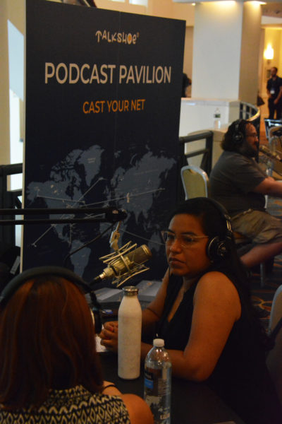 NextFab member and Jezabels Cafe prorprietor Jezabel Careaga on mic for a live interview at Podcast Movement 2018