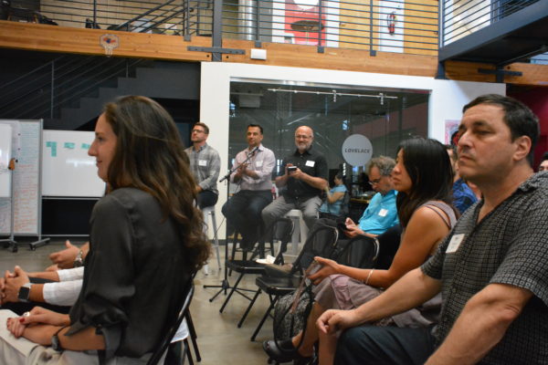 Feedback panel applauds presentations at the end of "Demo Day"