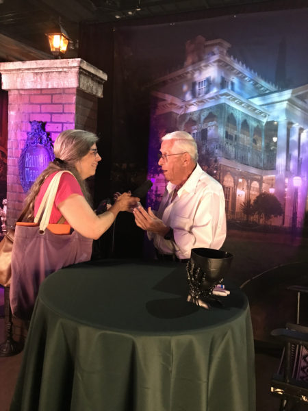 Legendary Disney Imagineer Bob Gurr talks with Over Coffee® host Dot Cannon at the "Haunted Orange County" booth at ScareLA™ 2018.