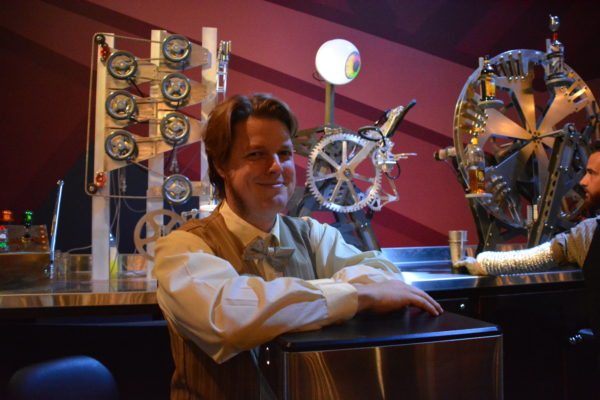 Robot designer Daniel Busby with robotic bartender "Gearmo Del Pouro" at Micro Amusement Park™