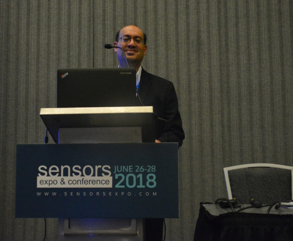 Eugene Demaitre at the lectern after his Sensors 2018 presentation on robots