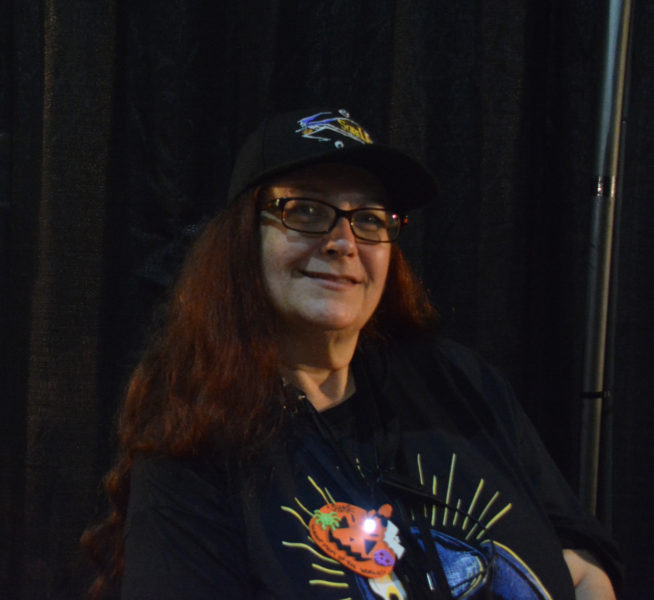 Shar Mayer smiles from the podcat booth at ScareLA