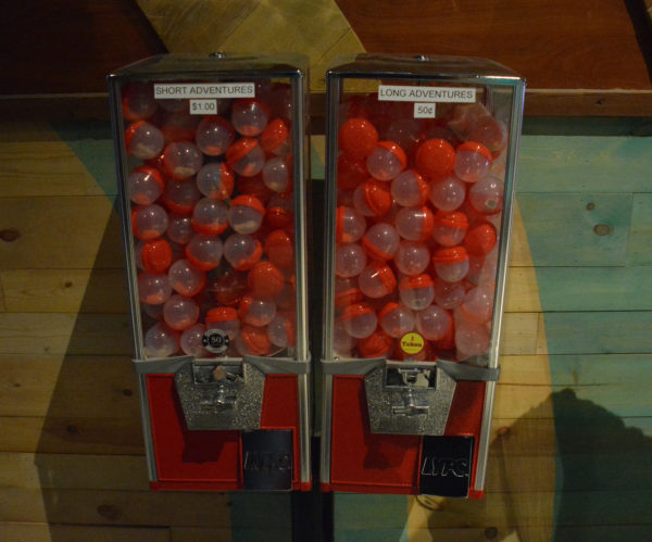 Gumball machines with "short adventures" and "long adventures" at Micro Amusement Park™