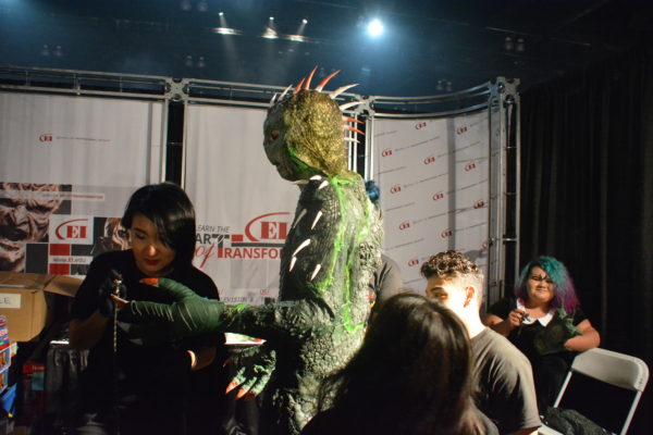 Three makeup artists transform a man into a lizard at ScareLA 2018