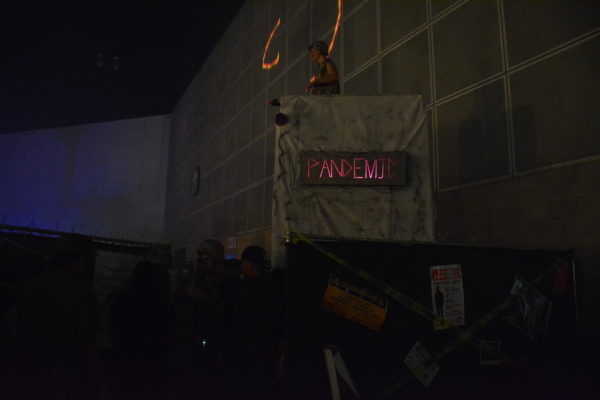 Pandemic sign in orange lights at ScareLA 2018