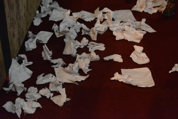 crumpled papers on the floor at ScareLA™ 2018 after visitors write down a piece of their lives they want to "release"