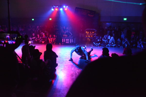 Slider slides across the floor in red and blue light at ScareLA 2018