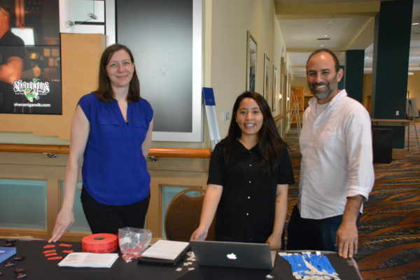 team of three Digital Promise staffers outside Edcamp entrance