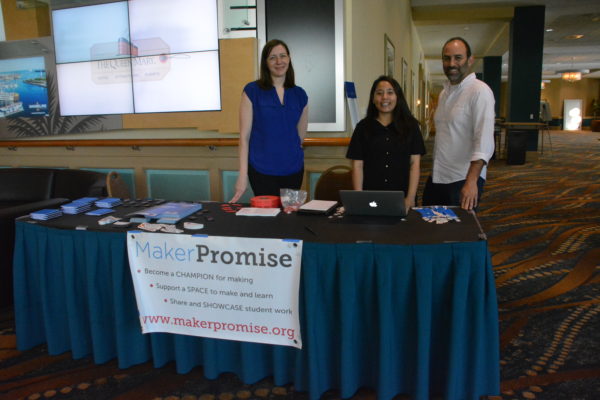 Three Digital Promise staffers at Maker Promise sign-in table