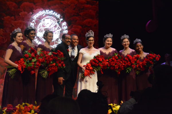 2019 Rose QUeen Louise Deser Siskel onstage with her court, 2019 Tournament of Roses President Gerald Freeny and MC Chris Schauble