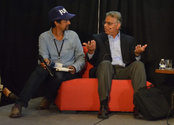 Dr. S.K. Gupta makes a point to panel host Shaun Arora during Toolbox L.A. Grand Opening