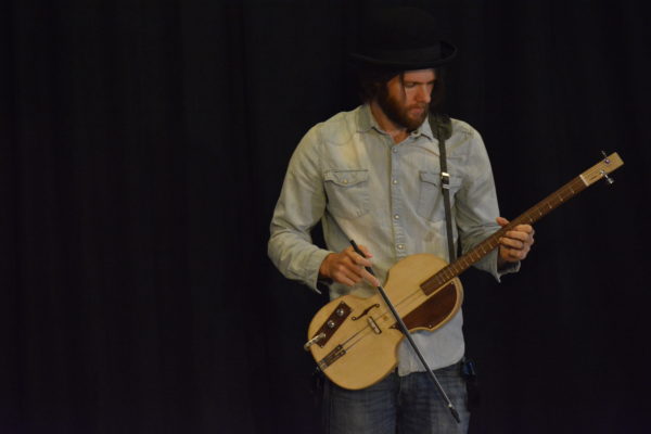 Musician and maker "Jude" plays the guitar he created at Toolbox L.A.