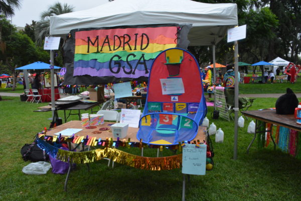 Carnival "gaymes" at rainbow-festooned Madrid High School booth at SGV Pride 2018