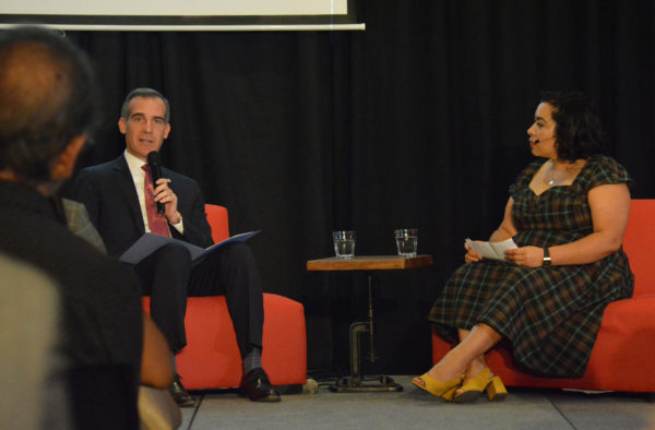 Los Angeles Mayor Eric Garcetti talks with Make In L.A. co-founder Noramay Cadena during "Fireside Chat" at Toolbox L.A. Grand Opening