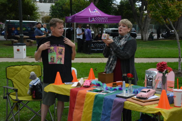 Alison Arngrim hands Mitch Braiman a "Nellie Candle" as part of his car award at SGV Pride 2018