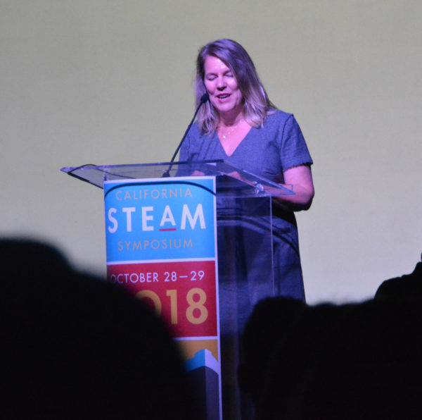 Shelly Masur speaks at lectern during California STEAM Symposium