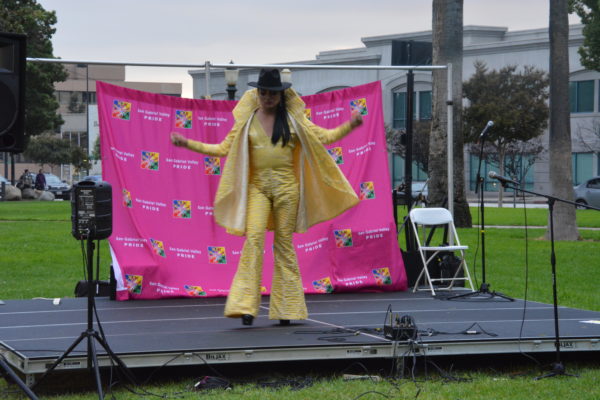 Dancer onstage in gold suit at SGV Pride 2018